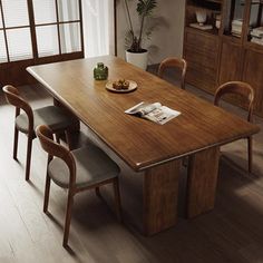 a dining room table with chairs around it