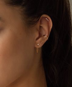 A Unique earring to elevate your ears. Only one ear piercing necessary for this earring. Safe for sensitive skin, our pieces are hand crafted and made to wear 24/7. 14k gold filled. Push on backings. 2mm diamond replica AAA CZ stone. Available as a pair or a single earring. 1 inch chain connects from the front to the back. Dainty 14k Gold Hypoallergenic Ear Cuff, Dainty Yellow Gold Piercings For Everyday Wear, Gold-plated Yellow Gold Dangle Cartilage Earrings, 14k Gold Dangle Cartilage Earrings For Everyday, Everyday 14k Gold Filled Dangle Cartilage Earrings, 14k Gold Dangle Cartilage Earrings, 14k Gold-filled Yellow Gold Cartilage Earrings, Everyday Elegant 14k Gold Filled Cartilage Earrings, Elegant Everyday 14k Gold Filled Cartilage Earrings