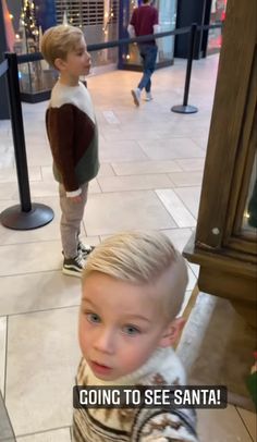 a little boy standing in front of a mirror with the caption going to see santa