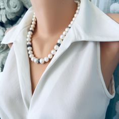 Add an elegant touch to any outfit with this Classic White Pearls Necklace. Crafted with exquisite attention to detail, this necklace features zircons pave rondelles for a stunning sparkle. The gunmetal plated and sterling silver materials lend a classy and timeless touch to this piece. Perfect as a Mother's Day gift or for a bride on her special day, this necklace is 20 inches in length and exudes sophistication and beauty. Complete your look with this exquisite piece of bridal jewelry and make Elegant Polished Pearl Necklace For Anniversary, Elegant Pearl White Jewelry With Gemstone Beads, Elegant Necklaces With Round Natural Stone Beads, Elegant Rondelle Pearl Necklace With Faceted Beads, Elegant Pearl Necklace With Faceted Rondelle Beads, Elegant Faceted Rondelle Pearl Necklace, Elegant Necklace With Round Natural Stone Beads, Elegant Single Strand Beaded Necklace For Jewelry Making, Elegant Pearl White Jewelry With Natural Stones