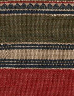 a red, green and blue striped rug with horizontal stripes on the bottom half of it