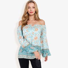 The Anna-Kaci Women's Off Shoulder Floral Print Long Sleeve Bohemian Blouse is a must-have addition to your wardrobe. This blouse features a beautiful and vibrant floral print that adds a touch of bohemian charm to any outfit. The off-shoulder design is perfect for showcasing your shoulders, while the long sleeves provide a comfortable fit. Made from lightweight and breathable fabric, this blouse is perfect for casual outings, beach trips, or any relaxed occasion. Pair it with jeans or shorts fo Fitted Boho Print Blouse For Beach, Peasant Style Long Sleeve Printed Top, Fitted Blouse With Boho Print For Beach, Flowy Floral Print Peasant Top For Festivals, Multicolor Flowy Bohemian Peasant Top, Summer Peasant Style Printed Blouse, Bohemian Long Sleeve Floral Print Top, Bohemian Long Sleeve Peasant Top With Floral Print, Long Sleeve Printed Peasant Top For Vacation