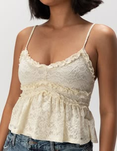 RSQ Womens Lace Ruffle Cami - IVORY | Tillys Flirty Lace Camisole For Spring, Ruffled Lace Camisole, Fitted Lace Camisole With Ruffles, Lace Tops With Ruffles And Spaghetti Straps, Lace Top With Ruffles And Spaghetti Straps, Lace Tops With Spaghetti Straps And Ruffles, Feminine Ruffled Camisole, Cream Lace Top With Ruffles For Summer, Summer Wedding Tops With Delicate Straps