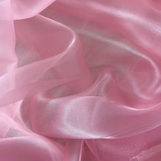 Baby Pink Crystal Organza Fabric by the yard, bulk or wholesale.  Delicately sheer, lightweight, and incredibly soft to the touch, it's the ideal choice for a wide range of projects. Our Light Pink organza fabric is perfect for creating exquisite garments and decorations.  Crafted from 100% polyester, this lightweight fabric offers a sheer and crisp drape, providing strength and elegance in every project. Whether you're designing ball gowns, wedding dresses, blouses, scarves, bridal apparel or fabric roses, organza is the ideal choice for achieving voluminous and structural effects. This baby pink organza fabric is also perfect for event decorations. Whether it's baby shower decor or wedding decorations, the sheer beauty of this organza fabric adds a captivating touch to any setting.  Prod Aesthetic Project, Bridal Apparel, Lotus Lake, Pink Widget, Dragonfly Painting, Pinterest Contest, Fashion Crafts, Event Decorations, Modest Dresses Casual