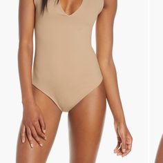 Washed Never Worn Chic Second-skin Bodysuit For Poolside, Stretch Bodysuit For Poolside, Chic Second-skin V-neck Swimwear, Chic Second-skin Swimwear For Spring, Chic Second-skin One-piece Bodysuit, Summer V-neck Smoothing Bodysuit, Chic One-piece Second-skin Bodysuit, Elegant Smoothing Bodysuit For Summer, Elegant Summer Smoothing Bodysuit