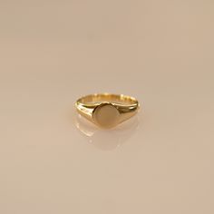 Sleek gold vermeil signet ring - timeless elegance for any look! 🌟 Perfect for you or as a special gift! 🎁💛 Check what's cool about it 😎 ✨Made from sterling silver with gold vermeil plating ✨Minimalist oval shape, approximately 1/2 inch wide ✨Versatile stackable ring or wear alone as a statement piece ✨Makes a thoughtful gift for any occasion ✨Please note, due to the nature of gold vermeil, some gradual wear over time is to be expected with regular use. We recommend gentle care to help prese Modern Gold Engraved Ring For Everyday, Timeless Gold Initial Ring For Everyday, Modern Rings With Smooth Finish As Gift, Classic Adjustable Gold Plated Rings, Gold Signet Ring For Everyday, Minimalist Signet Ring With Smooth Bezel For Promise, Gold Open Signet Ring With Simple Design, Modern Signet Ring With Round Band As Gift, Everyday Gold Signet Ring With Simple Design