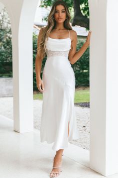 White, satin midi dress Lined Cowl neck Lace-insert waist Front split Lace-up back Zipper in back You will be unforgettable in our stunning Golden Era dress. We are loving its lace-insert waist, elegant cowl neck and sexy, lace-up back. Perfect for a wedding or special occasion where all the attention should be on YOU. Team it with diamante mules and a clutch and get ready to steal the show. MODEL INFO Model is wearing size XS Height: 5'7" Bust: 34" Waist: 24" Hips: 34" GARMENT INFO Flat garment Fitted Satin Midi Dress For Brunch, Midi Length Satin Slip Dress With Side Slits, Satin Backless Midi Dress For Prom, Satin Midi Dress For Brunch, Summer Satin Dresses With Side Slits, Backless Satin Midi Dress For Prom, Satin Midi Dress With Side Slits For Night Out, Backless Satin Bridesmaid Midi Dress, Elegant Dresses With Side Slits For Brunch