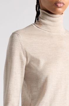 Tom Ford's tasteful elegance pervades this trim turtleneck sweater knit in Italy from silk-softened cashmere with finely ribbed trim. 23 1/2" length (size Medium) Turtleneck Long sleeves Ribbed cuffs and hem 70% cashmere, 30% silk Dry clean Made in Italy Designer Clothing High Neck Fine Knit Merino Wool Sweater, Elegant Beige Winter Turtleneck, Elegant Beige Turtleneck For Winter, Luxury Merino Wool Sweater For Formal Occasions, Elegant Wool Turtleneck For Winter, Elegant High Neck Turtleneck For Fall, Elegant Cashmere Sweater With Funnel Neck, Luxury Fine Knit Formal Sweater, Elegant Beige Sweater With Ribbed Collar