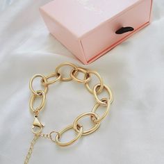 This link bracelet is a versatile chunky classy piece that goes with any look. Wear it with another bracelets to create an arm party. You can also linked this bracelet with another bracelet to wear them as a choker or link this bracelet with a choker for a longer length. Bracelet Details: Material: 18K Gold Plated & Stainless Steel Length: 7' Inch and you can add 2 inches with the extender Thickness: 12mm Quantity: 1 Color: Gold Does not tarnish/change color overtime Water Resistant Check Our Je Chunky Link Chain Jewelry For Parties, Party Jewelry Chunky Link Chain, Party Jewelry With Chunky Link Chain, Party Jewelry With Chunky Chain Link, Chunky Chain Oval Link Bracelet, Gold Chunky Chain Link Bracelet, Modern Chunky Chain Link Bracelets, Modern Chunky Chain Bracelets For Party, Metal Bangle Chain Bracelet For Parties