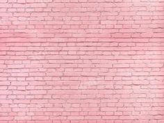 a pink brick wall that has been painted red