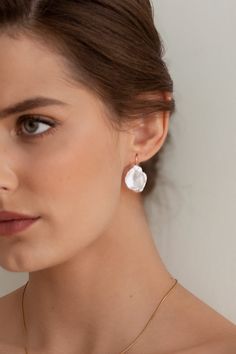 The Iris Pearl Earrings are handcrafted with baroque pearls-each pair is completely unique. They're paired simply with a 14k gold-filled ear wire to accentuate each pearl's natural beauty and charm.  Packaged in an elegant plastic-free reusable jewelry box, this necklace makes the perfect gift or special treat for oneself.   *14k gold-filled ear wires *Freshwater carved pearls (approximately 21-23mm height) *Hypoallergenic, suitable for even the most sensitive skin *Delivered in a 100% silk jewe Delicate Baroque Pearl Earrings With Pearl Charm, Delicate Baroque Pearl Teardrop Earrings, Delicate Baroque Pearl Earrings For Pierced Ears, Delicate Baroque Pearl Drop Earrings, Delicate Baroque Pearl Earrings, Garnet Heart, Money Images, Silk Jewelry, Real Pearls