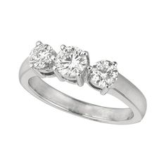 three stone diamond ring in white gold with diamonds on each side and four stones at the top