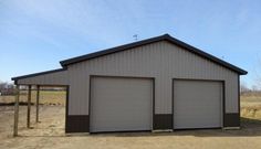 two garages in the middle of an empty field