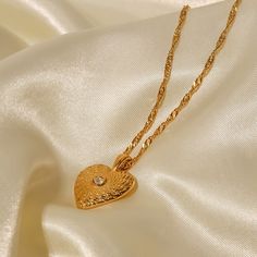 The Heart Necklace, in 18k gold plating, is an elegant symbol of love and affection. Its classic heart-shaped pendant adds a romantic touch to any look, making it perfect for everyday wear or special moments. Double Heart Rose Gold-plated Necklace, Elegant Gold-plated Heart Charm Necklace, Delicate Gold Heart Pendant Necklace, Gold Plated Double Heart Charm Necklace, Elegant Gold Plated Heart Pendant Charm Necklace, Gold Plated Heart Beaded Necklace For Anniversary, Elegant Yellow Gold Charm Necklaces With Heart Beads, Gold Plated Heart Necklace With Delicate Chain For Wedding, Elegant Yellow Gold Charm Necklace With Heart Beads