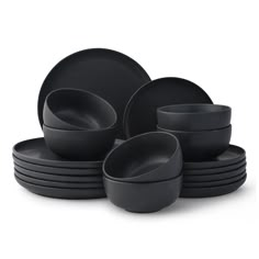 black dinnerware is stacked on top of each other