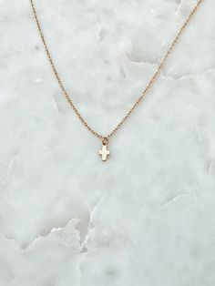 "This is a delicate tiny 14/20 gold or rose gold fill cross on a 14/20 gold or rose fill chain. It is perfect for layering or can be worn alone as it is here. Pictured: First - Gold, 14\" Second - Gold, 16\" Matching Bracelet: https://www.etsy.com/listing/240565680/tiny-cross-charm-bracelet-on-a-1420-gold?ref=shop_home_active_11" Dainty Cross Necklace For Everyday Wear, Minimalist Rose Gold Cross Pendant Jewelry, Minimalist Rose Gold Cross Pendant, Minimalist Cross Charm Necklace With Delicate Chain, Simple Necklace With Delicate Chain And Cross Pendant, Dainty 14k Gold Cross Necklace With Delicate Chain, Dainty 14k Gold Cross Necklace, Dainty Charm Necklace With Cross Pendant And Adjustable Chain, Dainty 14k Gold Cross Pendant Charm Necklace