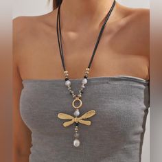 This Gorgeous Dragonfly Necklace Is A Must-Have For Any Fashion-Forward Individual. The Elegant Beading And Vintage Design Add A Touch Of Boho Chic To Any Outfit. Measuring 25 Inches With A 3 Inch Extension, This Necklace Is Perfect For Layering Or Wearing Alone. The Dragonfly Pendant Adds A Touch Of Whimsy To The Piece, Making It A Beautiful Addition To Any Jewelry Collection. It Is Brand New With Tags And Ready To Be Worn And Cherished. Item 03 Dragonfly Beaded, Leather Beaded Necklace, Clear Necklace, Large Pendant Necklace, Pearl Necklace Designs, Bold Necklace, Dragonfly Necklace, Pearl Decor, Boho Chic Jewelry