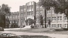 an old black and white photo of a building