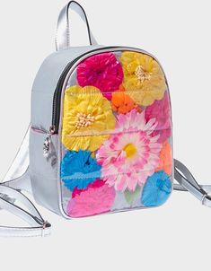 Betsey Johnson, Not Your Garden Variety Mini Backpack Floral Print  This sleek mini backpack has a smooth metallic silver surface decorated with a bright collection of large colorful flowers. Backpack Flower print Silver hardware Adjustable straps Adjustable drop strap Top handle Side pocket Silver exterior w front large colorful floral print 10" H x 9" W x 4" D Everyday Spring Rectangular Backpack, Multicolor Standard Backpack For Spring, Spring Standard Backpack With Adjustable Strap, Spring Backpack With Zipper Closure, Lips Logo, Velvet Backpack, Small Luggage, Design Backpack, Kiss Lips