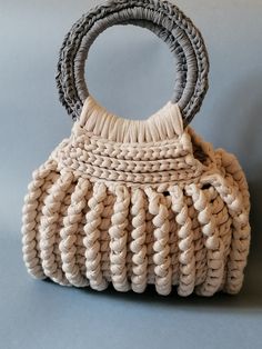 Crochet bag, with beige ribbon, roomy and comfortable. 26 cm high, with handles 39 cm, 27 cm wide. Chic Crochet Top Handle Bag With Rolled Handles, Cream Rectangular Shoulder Bag With Rolled Handles, Neutral Shoulder Bag With Rolled Handles For Daily Use, Cream Top Handle Shoulder Bag With Rolled Handles, Cream Shoulder Bag With Top Handle And Rolled Handles, Beige Handheld Hobo Bag With Braided Handles, Neutral Bags With Rolled Double Handles, Handheld Beige Hobo Bag With Braided Handles, Chic Handmade Beige Bucket Bag