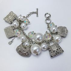 Pearl charm bracelet, allow 2-3 business days for delivery. Elegant Metal Charm Bracelet With Removable Charms, Everyday Bangle Charm Bracelet With Extender, Classic Adjustable Nickel-free Charm Bracelet, Classic Metal Bracelets With Charms, White Metal Charm Bracelet, Adjustable Jewelry With Removable Charms, Metal Pearl Charm Bracelet, Adjustable Metal Jewelry With Removable Charms, Everyday Metal Jewelry With Pearl Charm