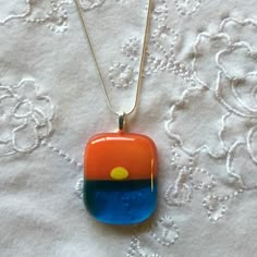 "Fused Glass Sunset Necklace with Turquoise blue water, yellow bright sun and orange sunset skies... Please note that all my items are Handmade so there may be slight color and / or design variations. The pendant is mounted on a sterling silver plated leaf bail. It comes on a 16\" OR 18\" silver plated snake chain necklace OR black leather cord (finished with silver plated lobster clasp and 2\" chain for adjustable length). Please choose your options upon checkout. Your pendant arrives in a gift Fused Glass Sunset, Sunset Necklace, Fused Glass Pendant Necklace, Sunset Skies, Fused Glass Necklace, Jewelry Ocean, Fused Glass Earrings, Fused Glass Artwork, Fused Glass Ornaments