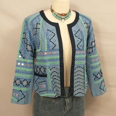 Well Decorated Cotton Jacket, Mid Blue With Green Trim, Copper, Silver Beaded, Stitch Work. Made In India. Label Is Simply Styled - Sears. Nineties. Condition Excellent, No Issues, Never Worn And Well Stored. Marked Size M, Shown On A 6 Mannequin. Length 20", Pit To Pit 20", Sleeves 20". Lined. Pockets. No Front Closure. Deadstock Vintage Embellished Long Sleeve Summer Outerwear, Summer Long Sleeve Embellished Outerwear, Casual Embellished Blue Outerwear, Casual Blue Embellished Outerwear, Spring Blue Beaded Outerwear, Casual Long Sleeve Beaded Outerwear, Spring Bohemian Outerwear With Sequins, Beaded Outerwear For Spring Festival, Bohemian Embellished Outerwear For Spring