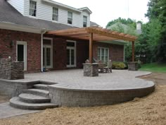 an outdoor patio with steps and seating area