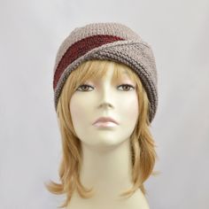 a mannequin head wearing a knitted hat