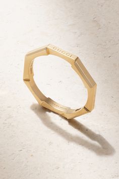 Gucci's 'Link to Love' ring is perfect for stacking alongside other styles in the collection. Made in Italy from 18-karat gold, it has a slim octagonal band that mimics a mechanical bolt and is engraved with the brand's moniker on one edge. Gucci Designer Rings In 14k Gold, Gucci 14k Gold Designer Rings, Designer Gucci 14k Gold Rings, Classic Gucci Bangle Bracelets, Modern Gucci Rings For Anniversary, Gucci Yellow Gold Rings For Formal Occasions, Timeless Gucci Jewelry For Anniversary, Gucci Fine Jewelry Yellow Gold Rings, Gucci Yellow Gold Fine Jewelry Rings