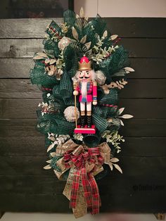 a christmas wreath with a nutcracker on it