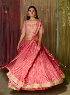 Editor's Note Featuring a coral pink brocade based blouse with brocade multi-tiered lehenga with belt and embroidered organza dupatta Color: Coral pink Fabric: Brocade Sleeve: Half Embroidery details: Zardozi Component: Blouse, Lehenga, belt and dupatta Lehenga length: 43" inches and blouse: 14" inches Occasion: Bridesmaid and sangeet Care: Dry clean only About the Designer Shyam Narayan Prasad started his journey in the Indian Fashion Design Industry with a couture women’s wear collection. The Lehenga With Belt, Lehenga Belt, Tiered Lehenga, Pink Brocade, Blouse Lehenga, Embroidered Lehenga, Embroidered Organza, Organza Dupatta, Color Coral