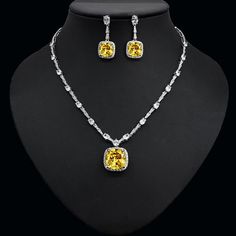 Enhance your ensemble with this exquisite Green Cubic Zirconia Pendant Necklace Earrings Set. Designed with precision, this set features: Main stones: AAA+ grade White Cubic Zirconia for stunning brilliance Metal: High-quality Copper with a White Gold color for an elegant look Eco-Friendly: Lead & Nickel Free for peace of mind Package: Comes in a stylish Gift Box, perfect for gifting Style: Square shape/pattern for a modern and chic appeal Elevate your style and make a statement with this elegan Formal Jewelry Sets With Cubic Zirconia Jewels, Diamond White Crystal Jewelry Sets With Matching Earrings, Dazzling Diamond White Jewelry Sets With Matching Earrings, Diamond White Cubic Zirconia Jewelry Sets With Matching Earrings, Elegant Yellow Jewelry Sets For Formal Occasions, Yellow Jewelry With Diamond Accents For Party, Green Diamond Jewelry Sets With Matching Earrings, Party Diamond Jewelry Sets With Matching Earrings, Diamond Jewelry Sets With Matching Earrings For Party