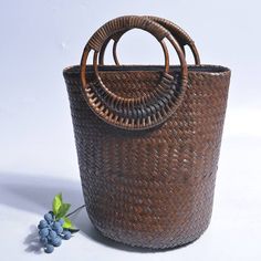 Our Larysa Bucket Bag is woven from straw and has a square shape with rounded handles. It is the perfect accessory for vacations or summer days in the city.Specs: Material: Straw Hollow Out Zipper closure Brown Bucket Bag With Braided Handles For Beach Season, Brown Rattan Shoulder Bag With Large Capacity, Brown Large Capacity Rattan Shoulder Bag, Rectangular Rattan Shoulder Bag With Large Capacity, Large Capacity Brown Rattan Shoulder Bag, Large Capacity Rectangular Rattan Shoulder Bag, Brown Woven Straw Bag For Vacation, Summer Rectangular Bag With Bamboo Handle, Trendy Beach Bags With Bamboo Handle