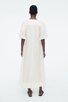 PLEATED A-LINE MIDI SHIRT DRESS - WHITE - COS Cos Dress, Neck Piece, Midi Shirt Dress, White Shirt Dress, Knitwear Cardigan, Mother Of Pearl Buttons, Flared Skirt, Dress Trousers, Shop Swimwear