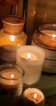 three candles sitting next to each other on a table