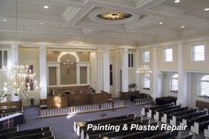 an empty church with pews and chandeliers