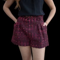 Upgrade Your Summer Wardrobe With Lavender Brown's Laura Shorts In A Playful Pink And Black Tweed Design. These Belted Shorts Effortlessly Combine Style And Comfort, Making Them A Versatile Addition To Your Collection. Perfect For Any Occasion, These Shorts Are A Must-Have For Any Fashion-Forward Wardrobe. Pink Short Pants With Pockets, Short Pink Pants With Pockets, Pink Short Length Pants For Spring, Summer Shorts With Belt Loops For Night Out, High-waisted Party Shorts With Pockets, Trendy Short Pink Pants, Trendy Pink Short Length Pants, Trendy Short-length Pink Pants, Trendy Short Length Pink Pants