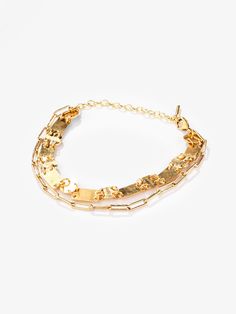 With a sleek brushed matte finish, this bracelet is a great mix of trend and charm. Its geometric shapes, ranging from circles to rectangles, borrowed from the art-deco era - still add a modern touch to your everyday look. The double-layered bracelet features our best-selling Mini Ellipse Chain. The matte texture and 24k gold plated finish make this an easy pick for work or play. Dimension: 6.10in (155mm) chain with 1.9in (50mm) extension chain and lobster clasp Elegant Double Band Metal Bracelets, Elegant Double Band Metal Bracelet, Modern Metal Chain Bracelet With Double Chain, Modern Double Band Bracelet Strap Jewelry, Modern Double Band Bracelet With Strap, Modern Chain Bracelet With Rectangular Links, Modern Double Chain Bracelet, Modern Matte Gold Bangle Bracelet, Metal Jewelry With Double Band Bracelet Strap