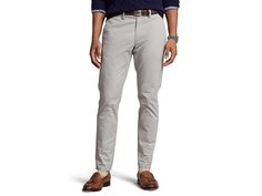 Polo Ralph Lauren Stretch Slim Fit Chino Pants - Men's Casual Pants : Soft Grey : Designed with a slim fit, the Polo Ralph Lauren Stretch Slim Fit Chino Pants feature high stretch fabric that sits comfortably at the waist and classic four-pocket styling. Finished with a belt-loop waist, and button-through back pockets. Slim-fit, high-stretch, pull-on cotton-blend chino pants in a solid colorway to make styling a breeze. Zipper-fly and button closure. Tapered leg with a straight hem. 97% cotton, Slim Fit Straight Leg Chinos With Belt Loops, Casual Fitted Dress Pants With Belt Loops, Casual Business Work Pants With Belt Loops, Casual Fitted Work Pants With Belt Loops, Slim Fit Straight Chinos With Belt Loops, Slim Fit Chinos With Belt Loops For Work, Workwear Slim Fit Chinos With Belt Loops, Slim Fit Tapered Leg Bottoms With Belt Loops, Chino Cotton Twill Work Pants With Belt Loops