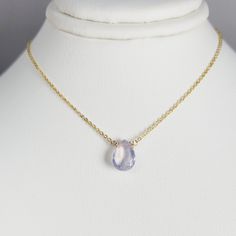 Add a touch of elegance with this handmade necklace, featuring a natural Lavender Quartz gemstone dangling in a handmade frame on a simple dainty chain. Choose your length for a choice to wear it as a choker or a long layered necklace. Simple, minimal, and elegant all-in-one necklace. Makes a great gift to add to any gemstone lover's collection. Perfect to gift for Christmas, Valentine's Day, Mother's Day, and more! Gemstone: Lavender Quartz, Scorolite Gemstone Size: 10.0 mm Gemstone Shape: Pan, Briolette Necklace, Handmade Frame, Lavender Quartz, Dainty Chain, Handmade Frames, Necklace Simple, Long Layers, Layered Necklace, Handmade Necklace