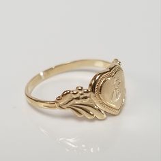 "Thanks for shopping our vintage estate store. We tend to sell well below wholesale and truly hope you enjoy all of our items. Many of the items are one of a kind, so please enjoy scrolling through the pictures and hopefully something will catch your eye. Brown spots are from camera or reflections. Estate 14k yellow gold monogram cursive capital E heart ring. Custom made ring for our shop. Ring size: 3 Setting: 7.5mm 1/4\" to 3/8\" Band width: 1.5mm Weight: .98 gram Marked 14k and it's sweet. On Antique Style Rings, Gold Monogram, Jewelry Lookbook, Girly Jewelry, Antique Style, Heart Ring, Favorite Jewelry, Gold Rings, Gold Bracelet