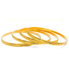 These Engraved High Finish Bangles are a must-have in any jewelry collection. Crafted from 22k yellow gold, this set of four bangles has a combined weight of 52.1 grams. The intricate engraving adds a touch of elegance to the high-gloss finish, making them a perfect statement piece. The bangles have a size of 2.8 and an opening of 2.5 inches. PRODUCT DETAILS Gold Purity(karat): 22k Gold Weight(grams): 52.1 Item Finish: Yellow Gold Bangle Size: 2.8 Bangle Opening: 2.5" Number Of Pieces: 4 Bangles Yellow Gold Plated Bangle For Puja, Yellow Gold Round Bangle For Puja, Traditional Engraved Yellow Gold Bangle, Gold Bangle With Polished Finish For Ceremonial Events, Yellow Gold Round Bracelet For Puja, Ceremonial Gold Bangle With Polished Finish, Yellow Gold Bracelet For Puja, Ceremonial Polished Gold Bangle, Traditional Yellow Bangle For Formal Occasion