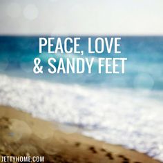 the words peace, love and sandy feet are in front of an ocean