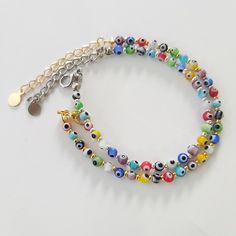 Rainbow Evil Eye Rainbow Beaded anklet bracelet and choker, Evil eye jewelry, Boho,Beach Jewelry,Summer,Festival ,Yoga Gift Present,Protection Bracelet Handmade Bracelet with Rainbow Evil Eye MATERIAL ♥ Glass Beads evil eye size 4mm ♥ Gold Plated/ Silver Plated Beads size 2mm ♥ 2 inch extender chain (5cm) SIZE ♥ Adjustable size bracelet 5.5 - 7 inches ♥ Adjustable size anklet 8.5 - 10.5 inches ♥ Adjustable size choker 12 - 15 inches Please message me the size of your request! White Beaded Choker For Festivals, Trendy Multicolor Beaded Evil Eye Bracelet, Multicolor Beaded Chain Anklets As Gift, Trendy Anklets With Round Beads For Festivals, Trendy Handmade Multicolor Anklets, Bohemian Multicolor Beaded Chain Anklets, Trendy Multicolor Handmade Anklets, Colorful Beads Evil Eye Bracelet For Beach, Bohemian Evil Eye Bracelet With Tiny Beads For Beach