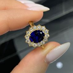 This Ring Was Especially Designed For Princess Diana To Match The Color Of Her Eyes... It has its own royal story and since then has been an inspiration for many woman as an identification of princess Diana's absorbing personality - Ring details - Center Stone - 2,00 ct Oval Cut Blue Sapphire Gemstone - Check out the Amazing Deep Blue Color in the video Excellent Graded Cut Side Stones - 1,40 ct Total Round Brilliant Cut Natural Diamonds Total - 14 Diamonds of 0,10 ct Each  Color And Clarity - D-E-F VVS1 Band - 18K Yellow Gold  Available Also In - Rose Gold 18K And White Gold 18K  Center Stone can be changed according to your own budget. All you have to do is send us a private message / call and we will offer you in the most professional way options of other center stones from our own and Gold Sapphire Diamond Ring With Halo Design, Elegant Royal Blue Brilliant Cut Rings, Elegant Gold Ring With Lab-created Sapphire, Dazzling Oval Sapphire Ring, Exquisite Oval Sapphire Ring With Diamond, Gold Oval Sapphire Ring With Brilliant Cut, Dazzling Sapphire Oval Diamond Ring, Dazzling Sapphire Diamond Ring, Oval Shape, Luxury Gold Sapphire Ring With Halo