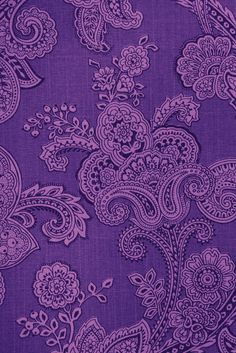 purple paisley fabric with white flowers and leaves on the bottom, as well as an image of