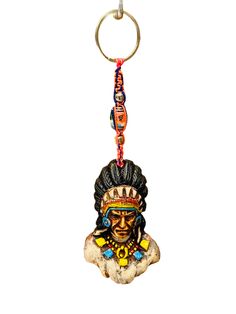 a key chain with a native american head on it