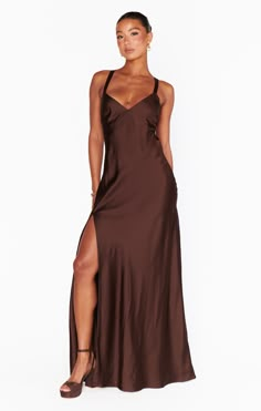 Raise a glass in the Anderson Maxi Dress! Sleek, chocolate satin shapes this chic dress with an open back and criss cross ties. This flattering, floor length dress exudes glamour. Style with strappy heels and dainty gold jewelry for your next event. Elegant Formal Maxi Dress With Strappy Back, Elegant Satin Dress With Strappy Back For Night Out, Brown Satin Maxi Dress For Evening, Brown Satin Maxi Length Dress, Elegant Brown Satin Maxi Dress, Chic Satin Maxi Dress With Strappy Back, Elegant Strappy Back Maxi Dress For Evening, Chic Strappy Back Maxi Dress For Formal Occasions, Elegant Evening Slip Dress With Strappy Back