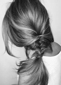 black and white photograph of a woman's head with her hair in a pony tail